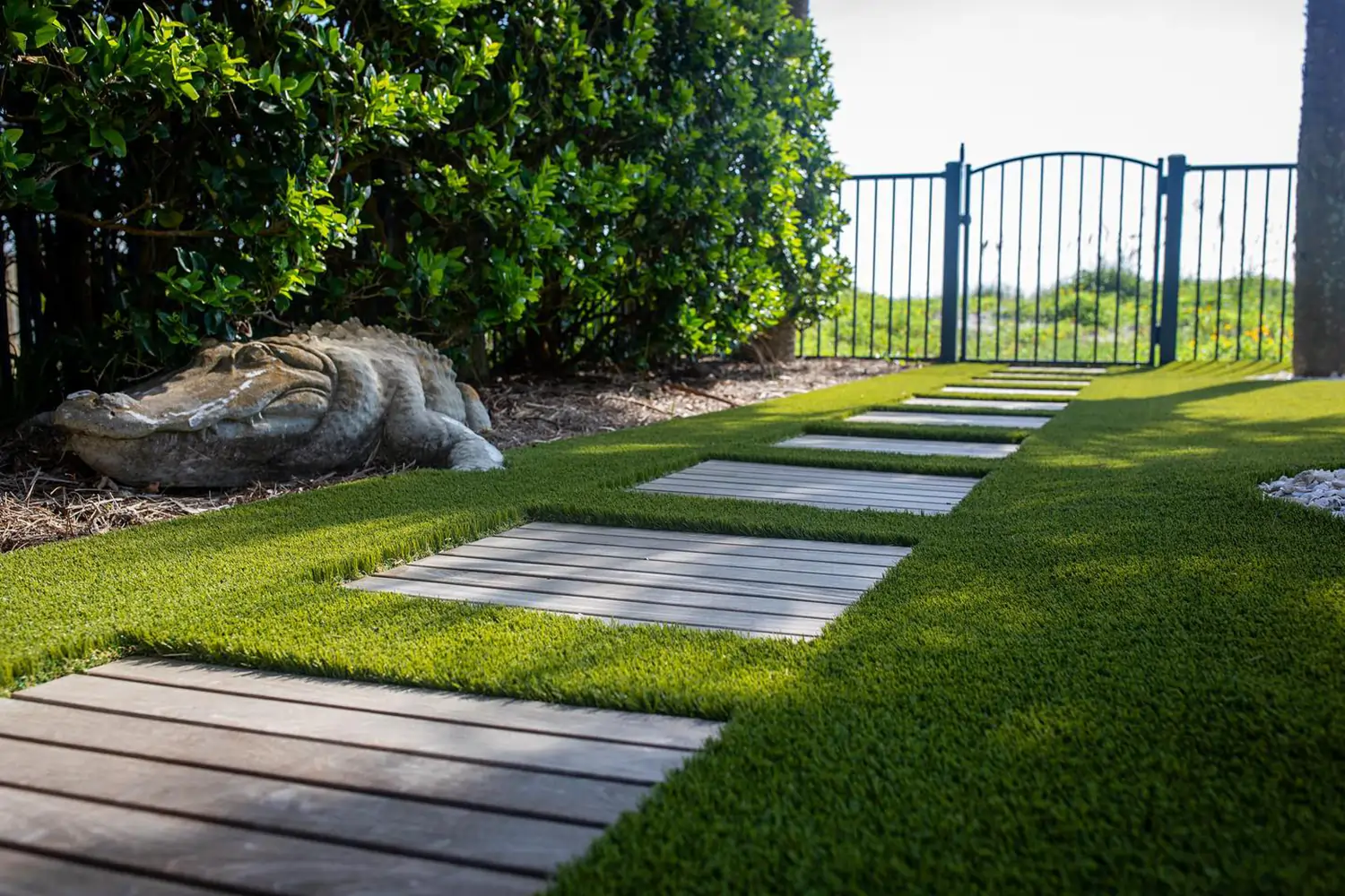 Ceramic aligator on artificial grass lawn from SYNLawn